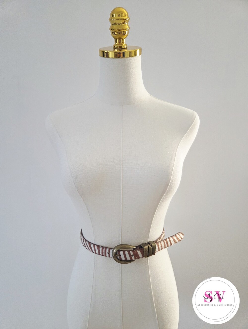 Brown & white striped belt with brass tone buckle